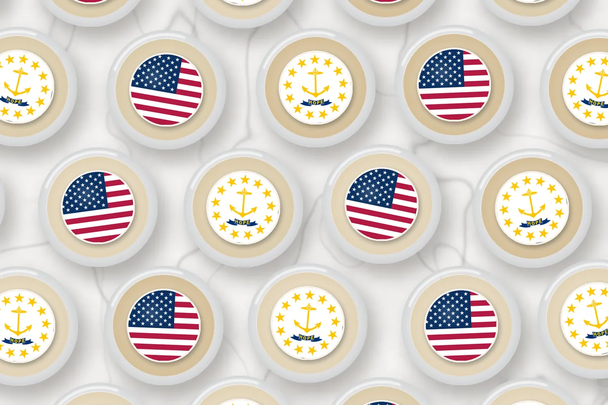 Cocktails topped with edible drink toppers printed with the Rhode Island flag and the American flag