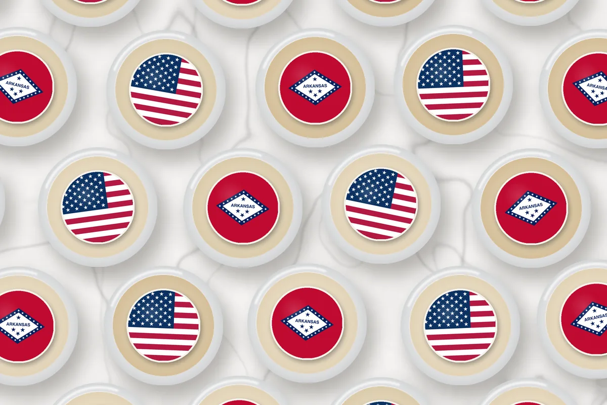 Cocktails topped with edible drink toppers printed with the Arkansas flag and the American flag