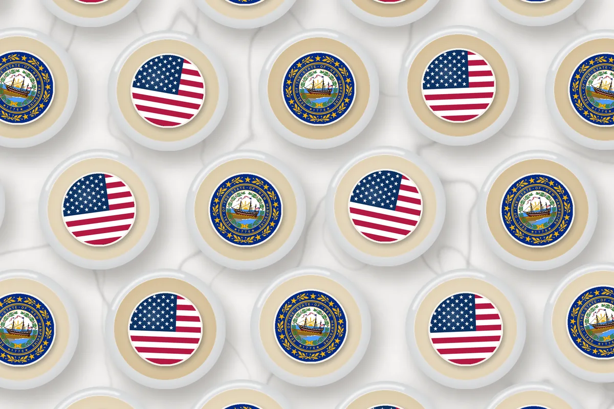 Cocktails topped with edible drink toppers printed with the New Hampshire flag and the American flag