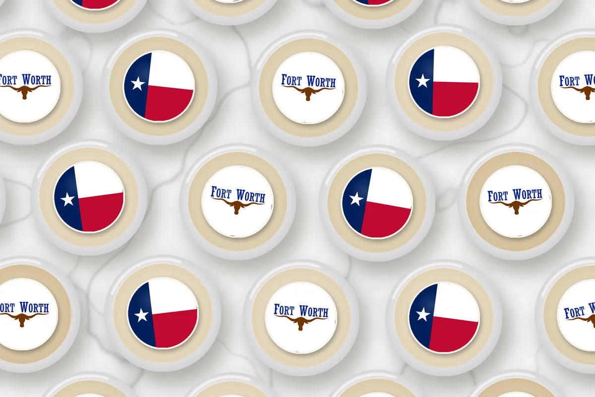 Cocktails topped with edible drink toppers printed with the Fort Worth city flag and the Texas flag