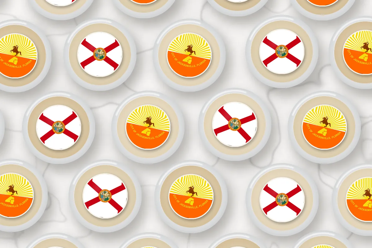 Cocktails topped with edible drink toppers printed with the Jacksonville city flag and the Florida flag