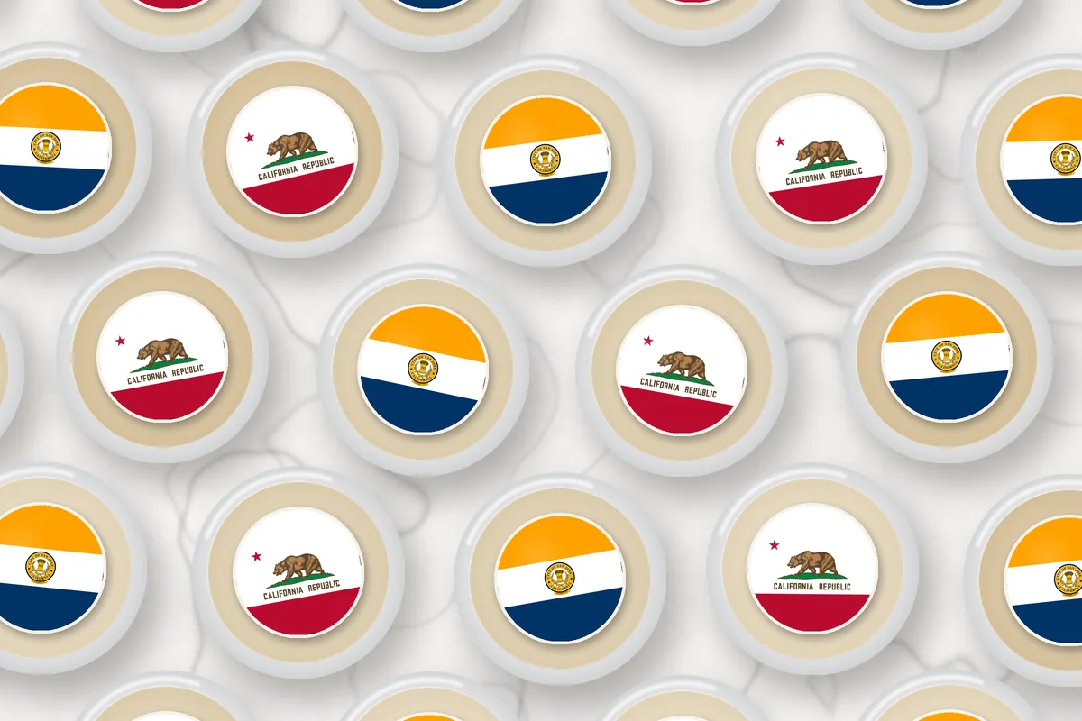 Cocktails topped with edible drink toppers printed with the San Jose city flag and the California flag