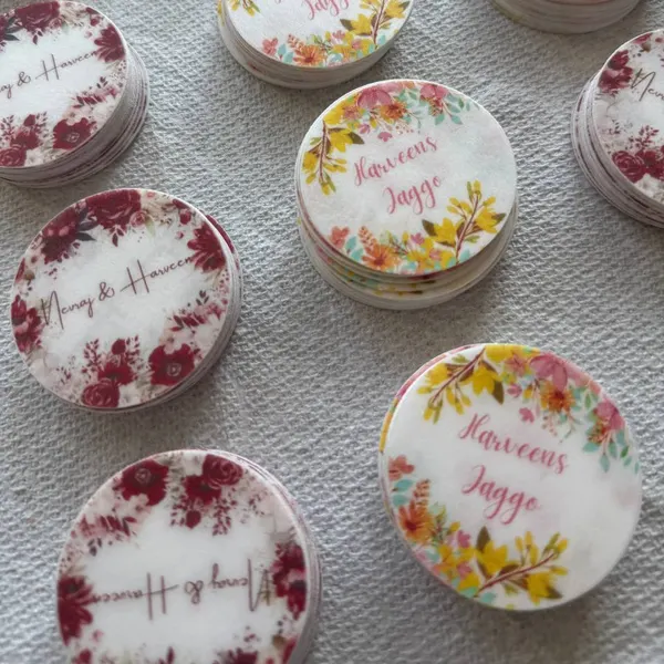 Floral edible toppers printed with names for a celebration