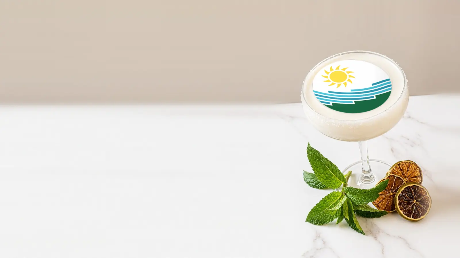 Coupe cocktail topped with a round edible frosting sheet topper printed with the Spokane city flag
