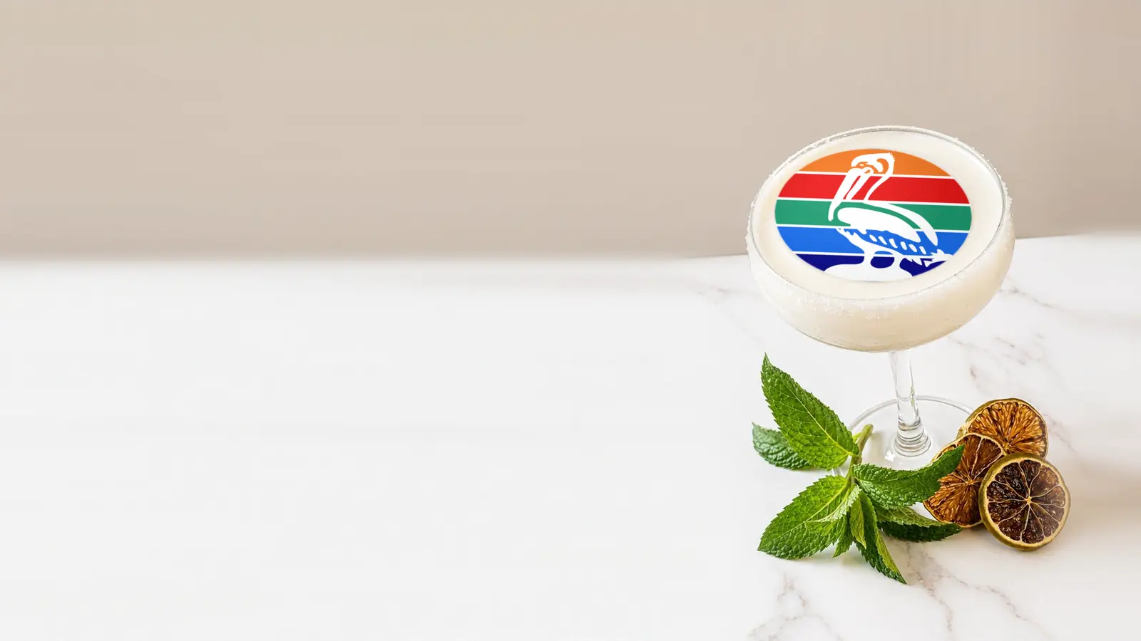 Coupe cocktail topped with a round edible frosting sheet topper printed with the St. Petersburg city flag