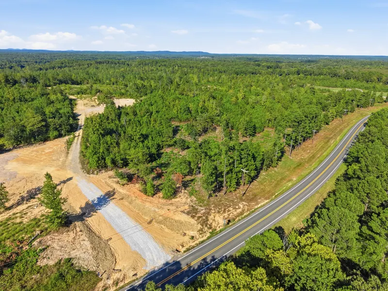 Highway 128 curve and wooded frontage