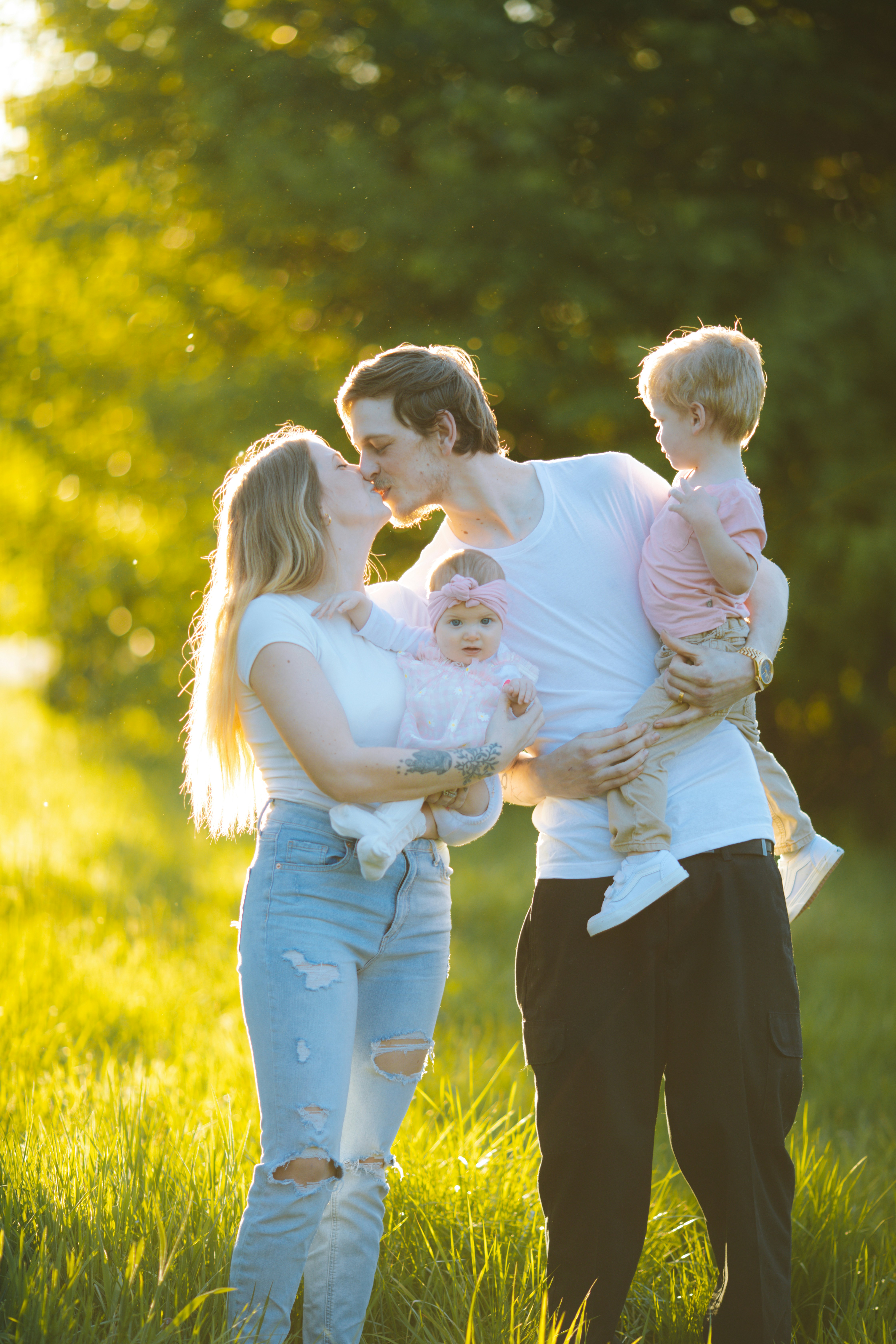 A family, a couple and their two children in nature A family, a couple and their two children in nature