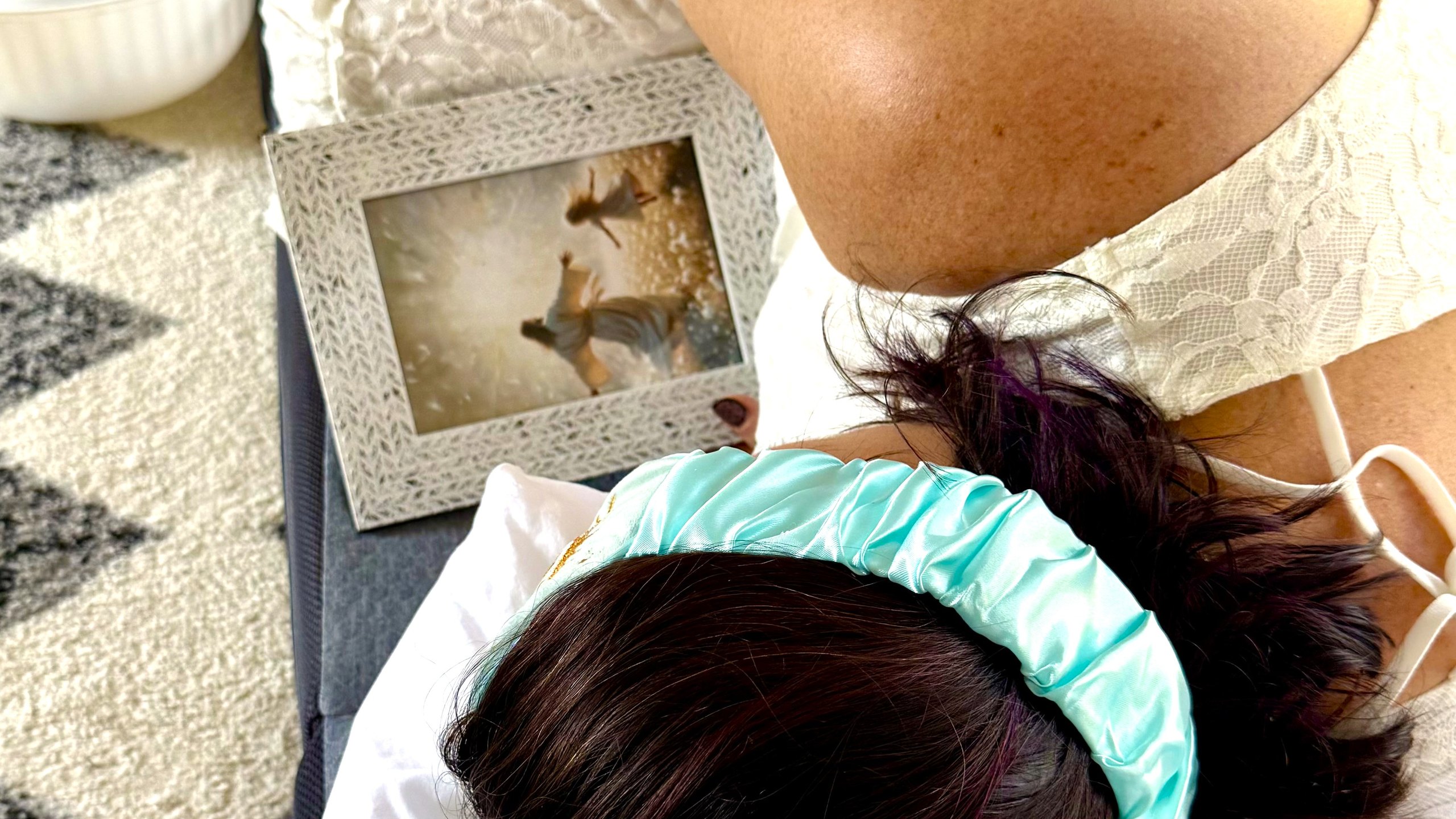 A member resting in ceremony beside an image of Christ