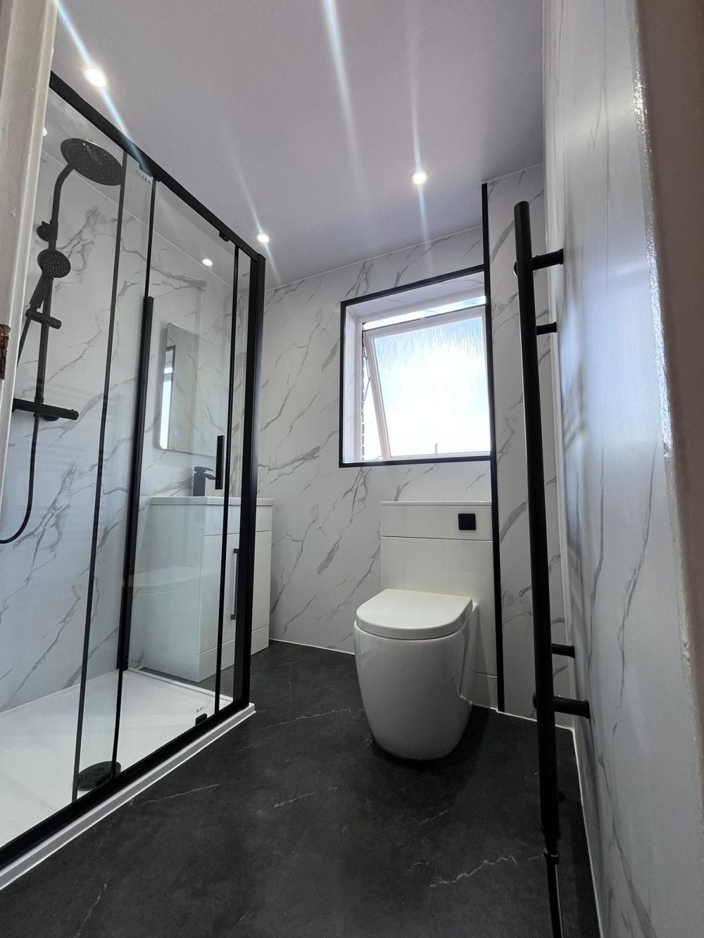 Black and marble shower room