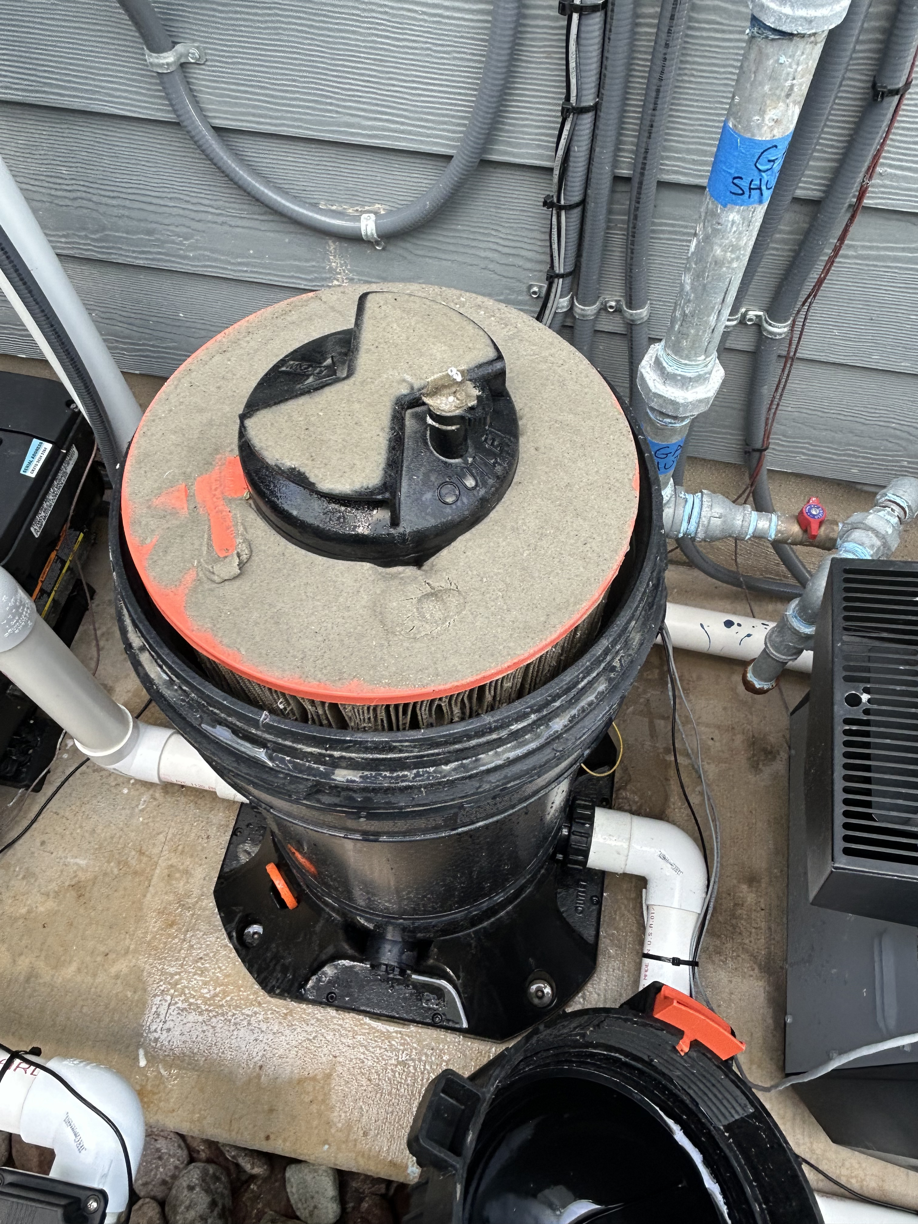 Pool filter cleaning in Corpus Christi pool equipment pad