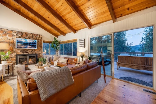 Starry Night Cabin outdoor deck — evening lights, hammock, hot tub