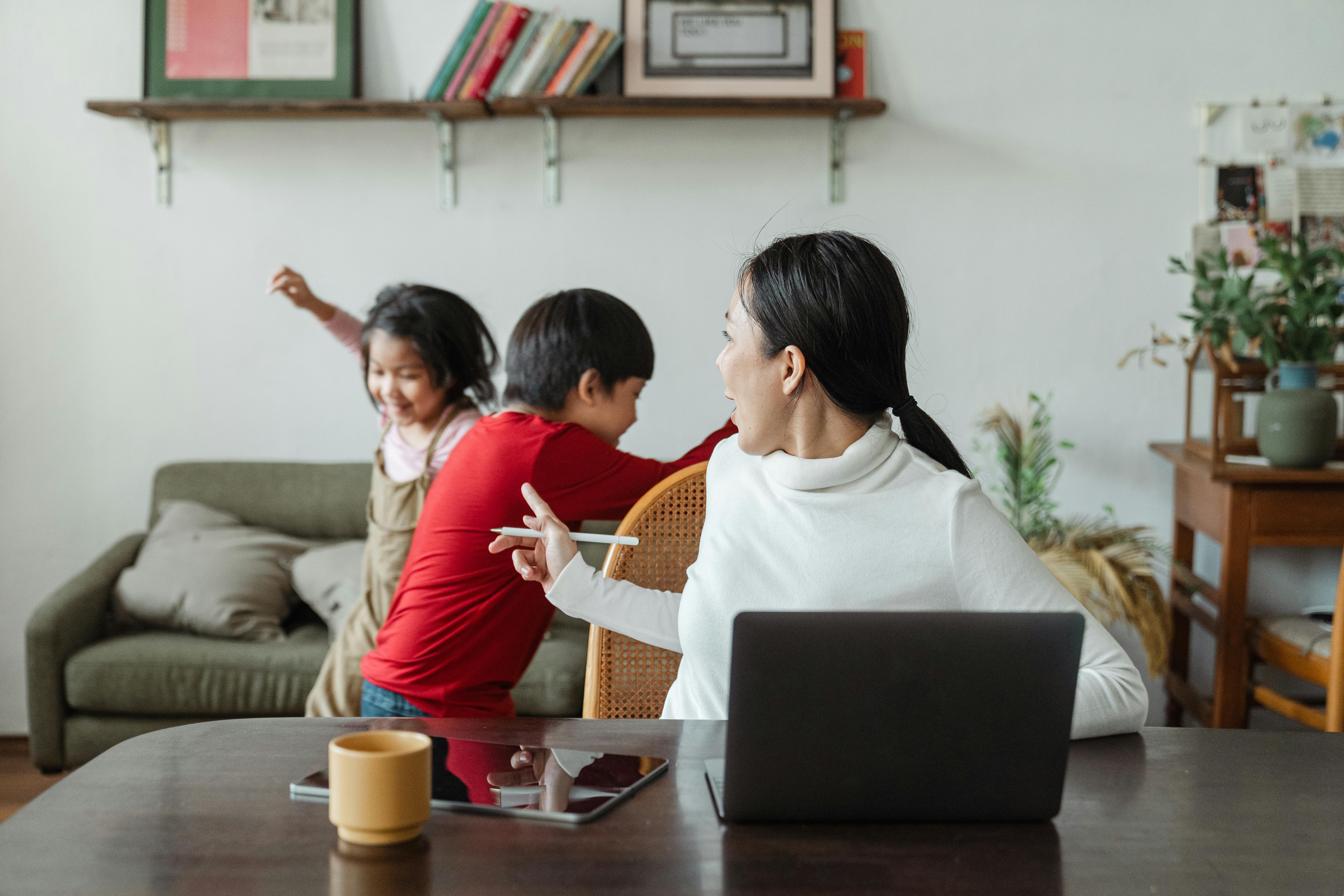 Mother snapping at kids from being overwhelmed by the noise