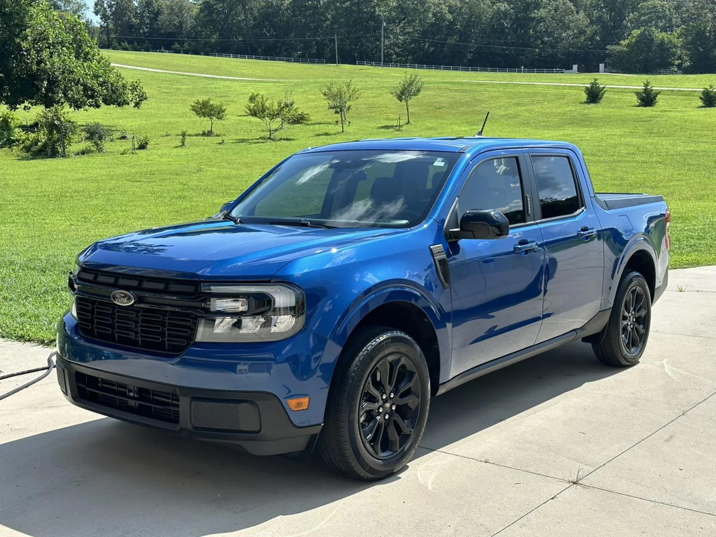 Metallic Blue Ford Maverick truck with hydrophobic ceramic coating and intense water beading
