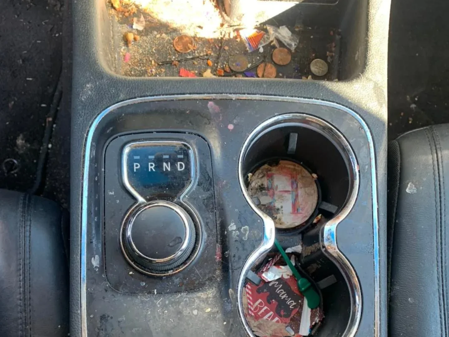 Before: Center console cupholders before and after degreasing and steam cleaning