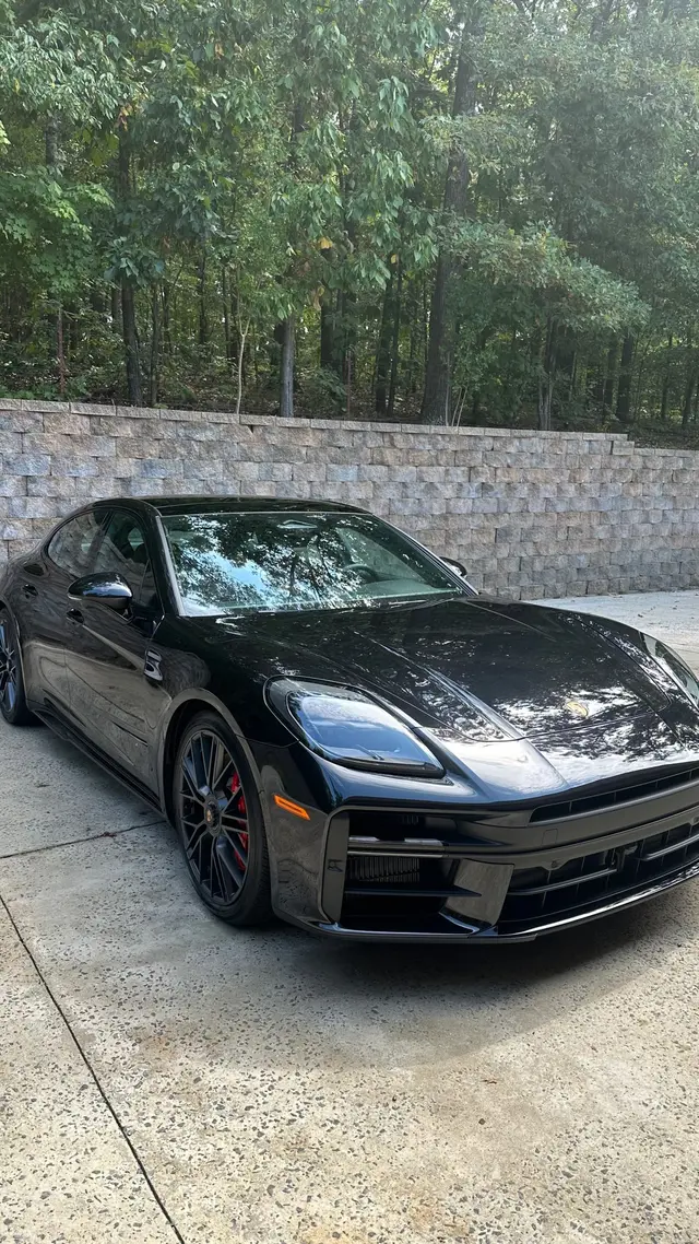 Black Porsche Panamera GTS with reflective paint after ceramic coating in Ooltewah