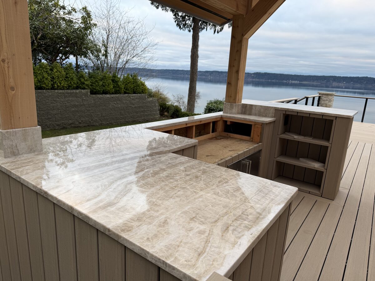Outdoor kitchen with quartzite countertops overlooking Puget Sound