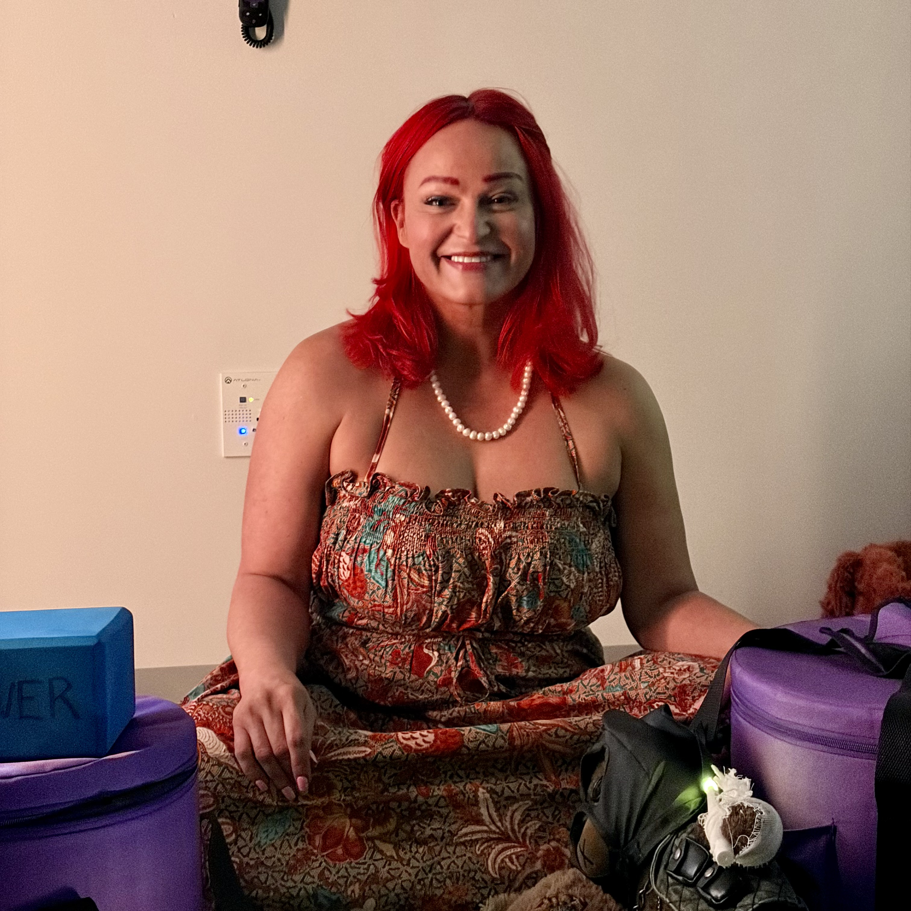 Helen DeLovely smiling in the Somatic Room at The Healing Haven