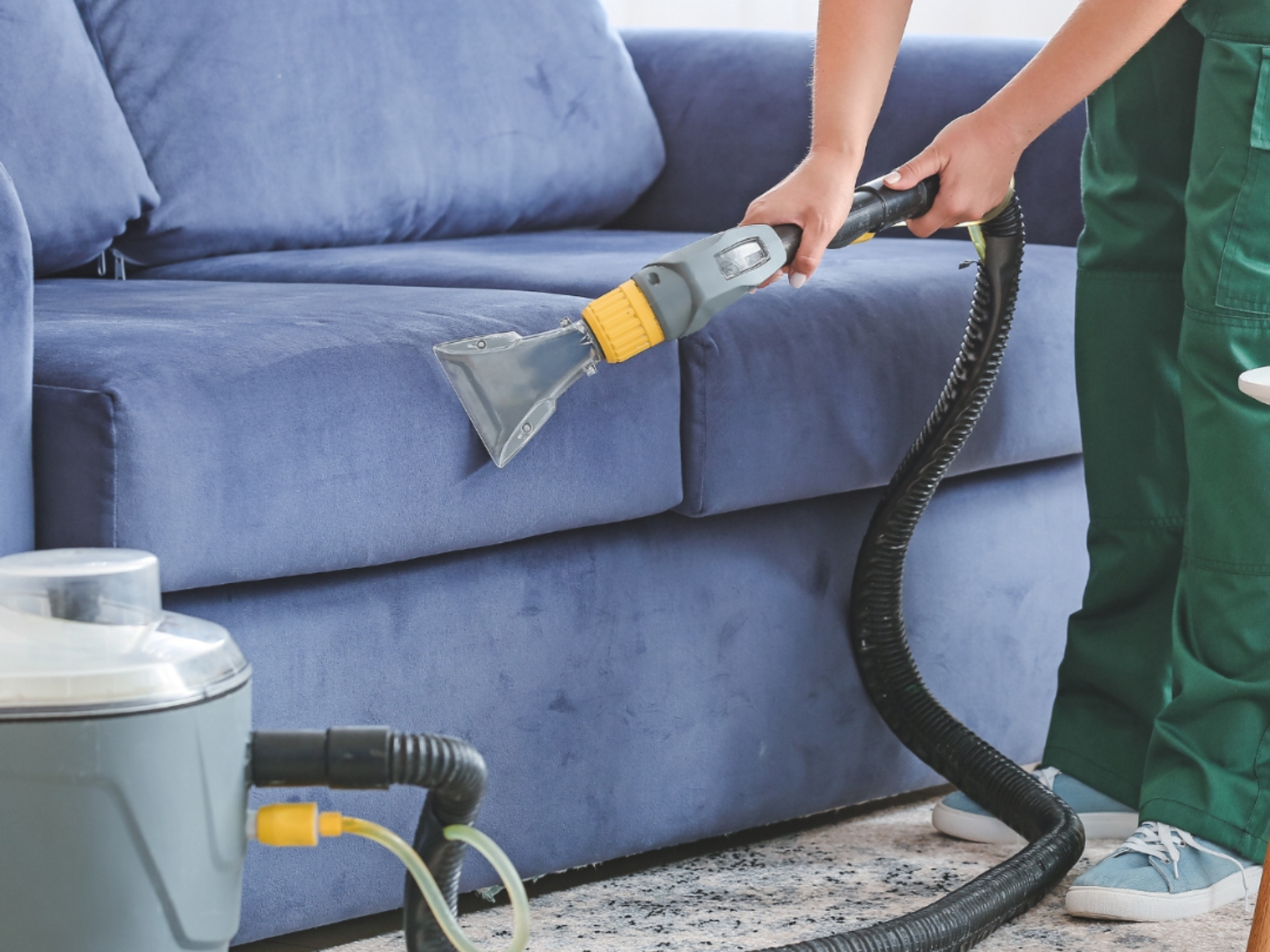 Unrushed Limited team member cleaning upholstery