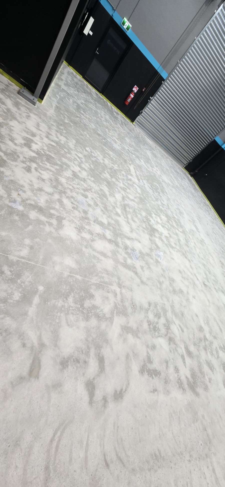 Close-up of the smooth, durable epoxy coating reflecting overhead light in the factory