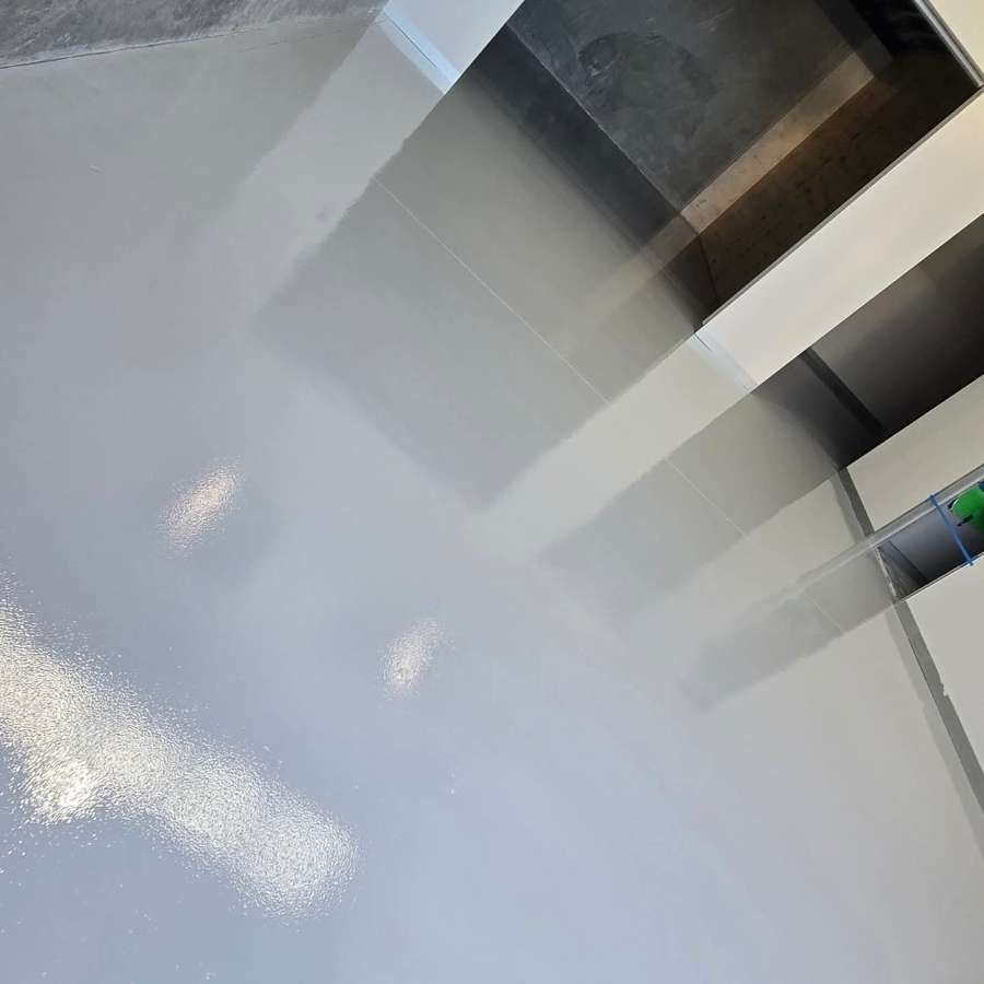 High-gloss epoxy surface showing the depth of the heavy-duty factory floor finish