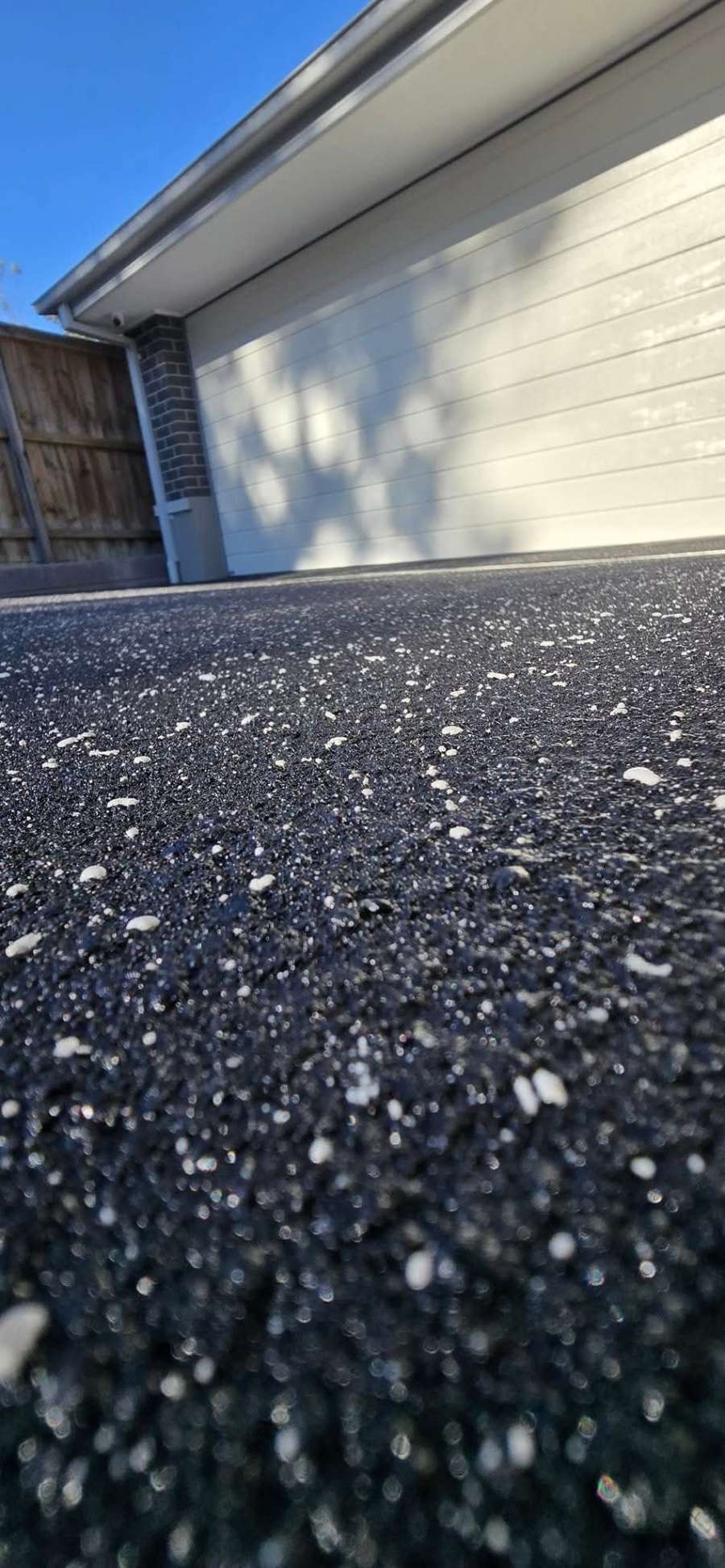 Worn, stained plain concrete slab before resurfacing