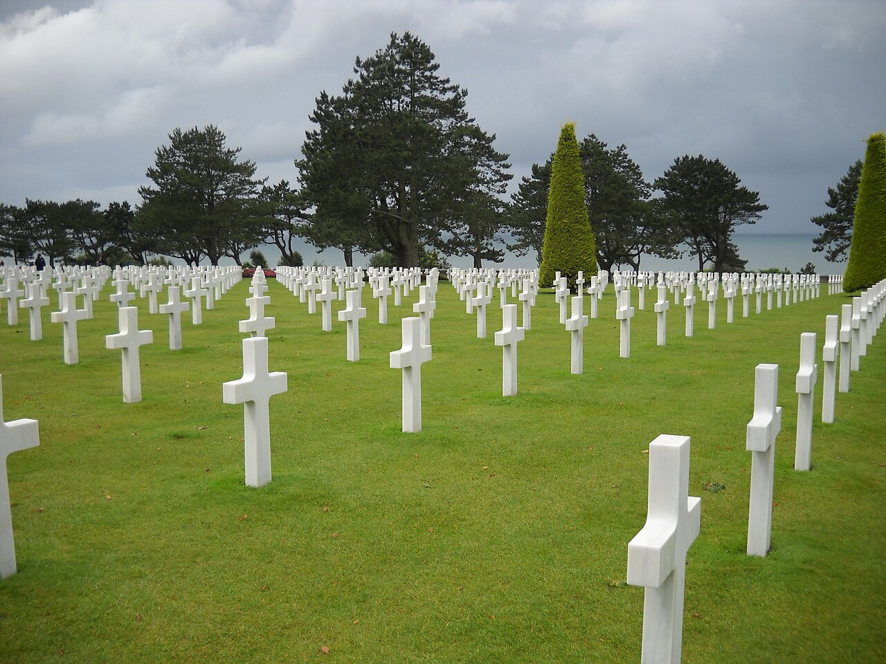 Rows of white crosses at the Normandy American Cemetery overlooking Omaha Beach in Normandy, France.