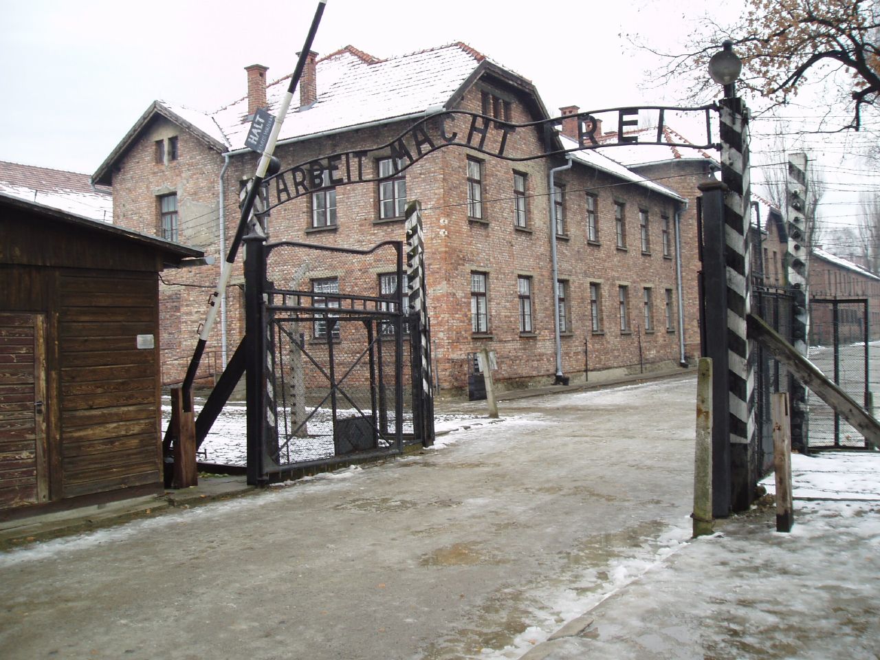 Main gate of Auschwitz I concentration camp in Poland with the “Arbeit Macht Frei” sign above the entrance.