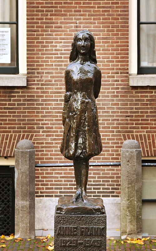 Statue of Anne Frank near the Anne Frank House in Amsterdam Netherlands honoring the Jewish diarist who hid from the Nazis during World War II.