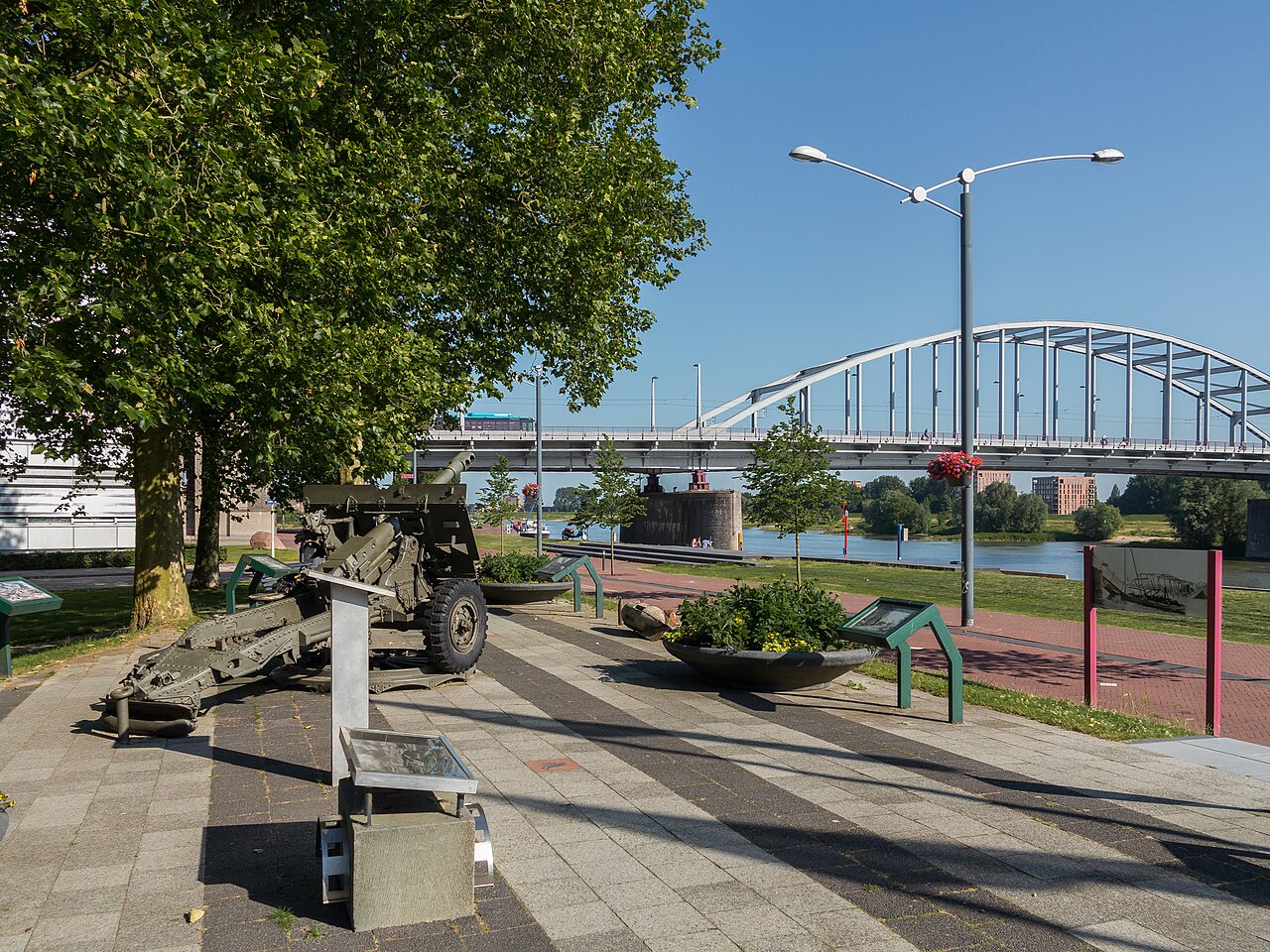 Airborne Monument in Arnhem Netherlands with John Frost Bridge in background commemorating the Battle of Arnhem during Operation Market Garden in World War II.