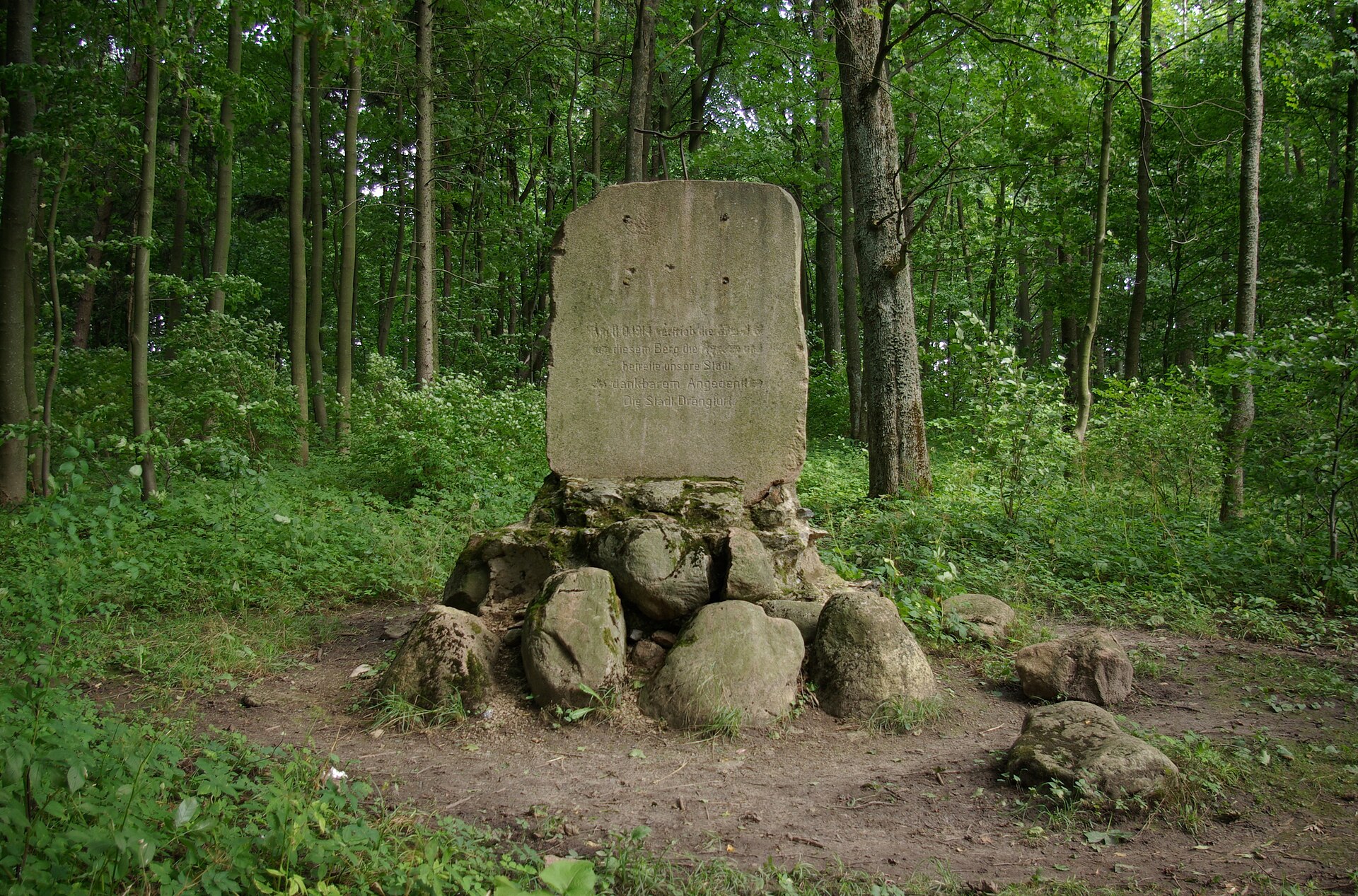 World War I German memorial near Srokowo, Poland marking the 1914 defeat of Russian forces on the Eastern Front in a forest setting.
