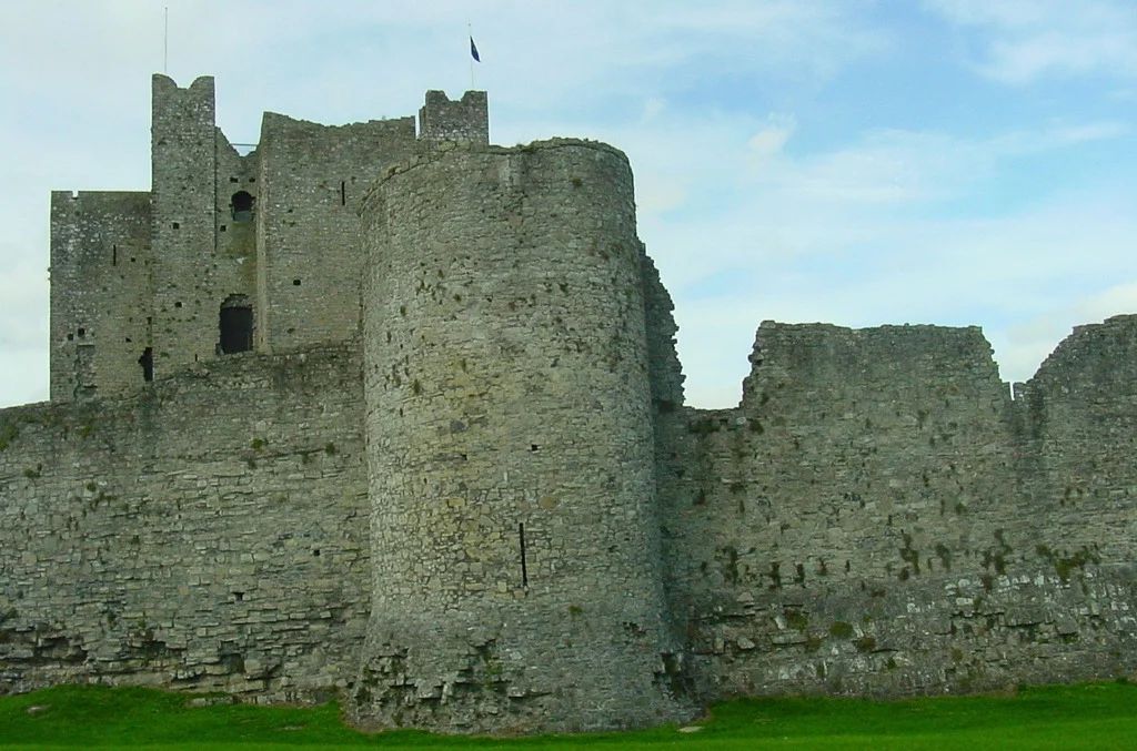 Exterior stone walls and rounded defensive tower of Trim Castle, a medieval Anglo-Norman fortress in County Meath, Ireland. Exterior stone walls and rounded defensive tower of Trim Castle, a medieval Anglo-Norman fortress in County Meath, Ireland.