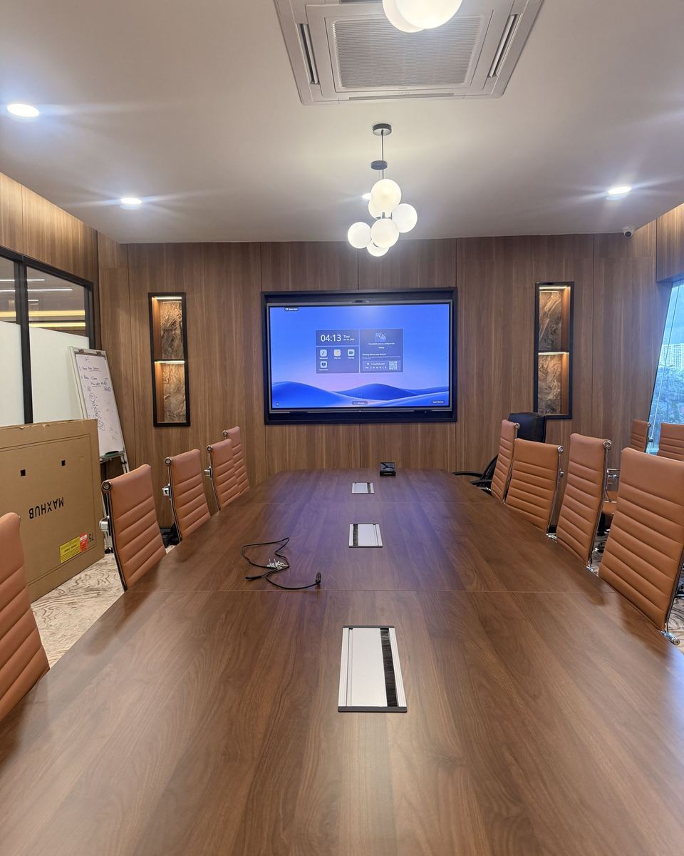 Boardroom with tan leather chairs, panel just installed