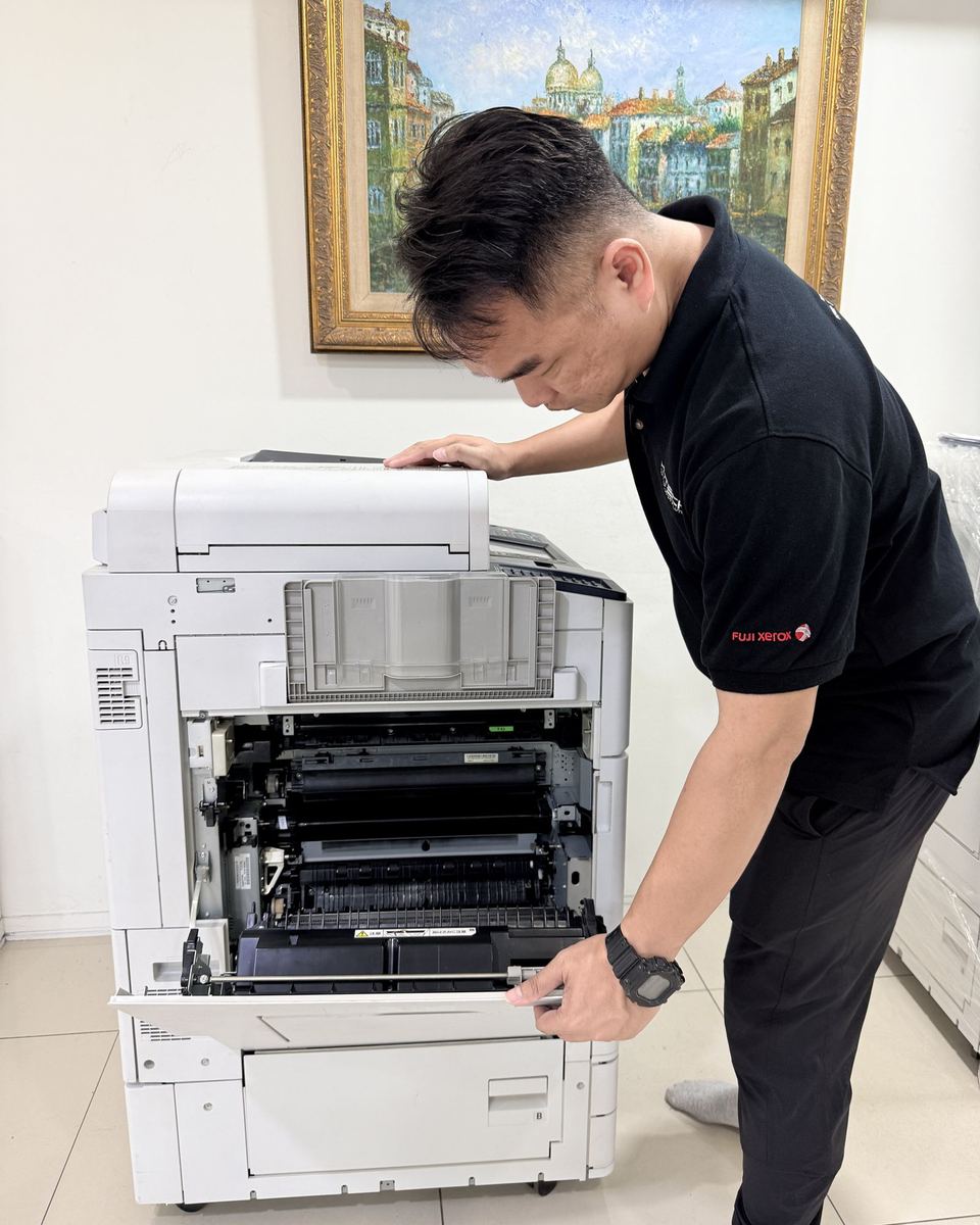 Hytech technician checking a photocopier