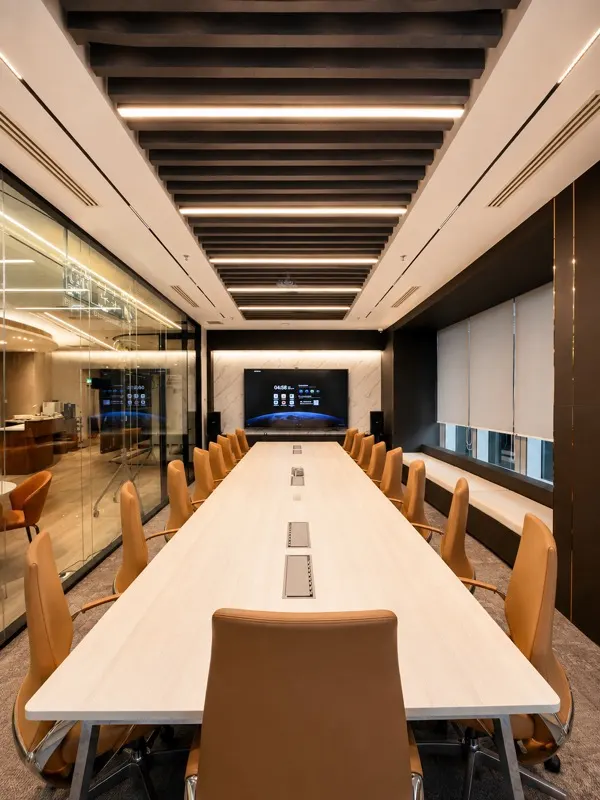 Nexus Executive Boardroom, one long table, so every guest sees the screen
