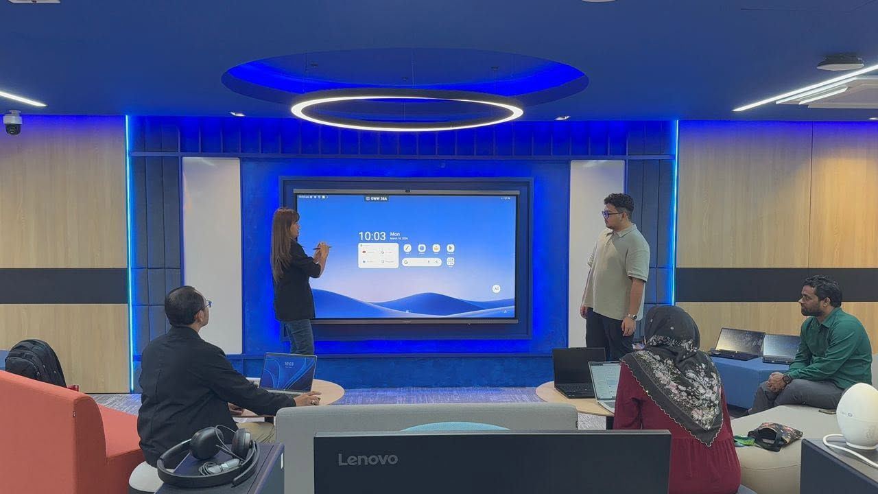 Team using a MAXHUB interactive panel in a collaboration room fitted by Hytech