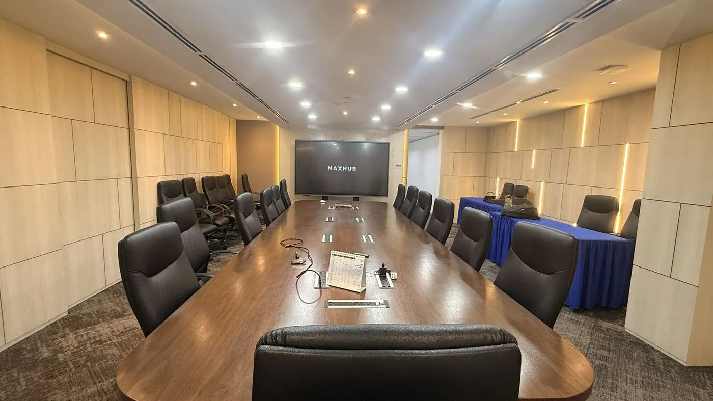 Large boardroom with a wall-mounted MAXHUB panel