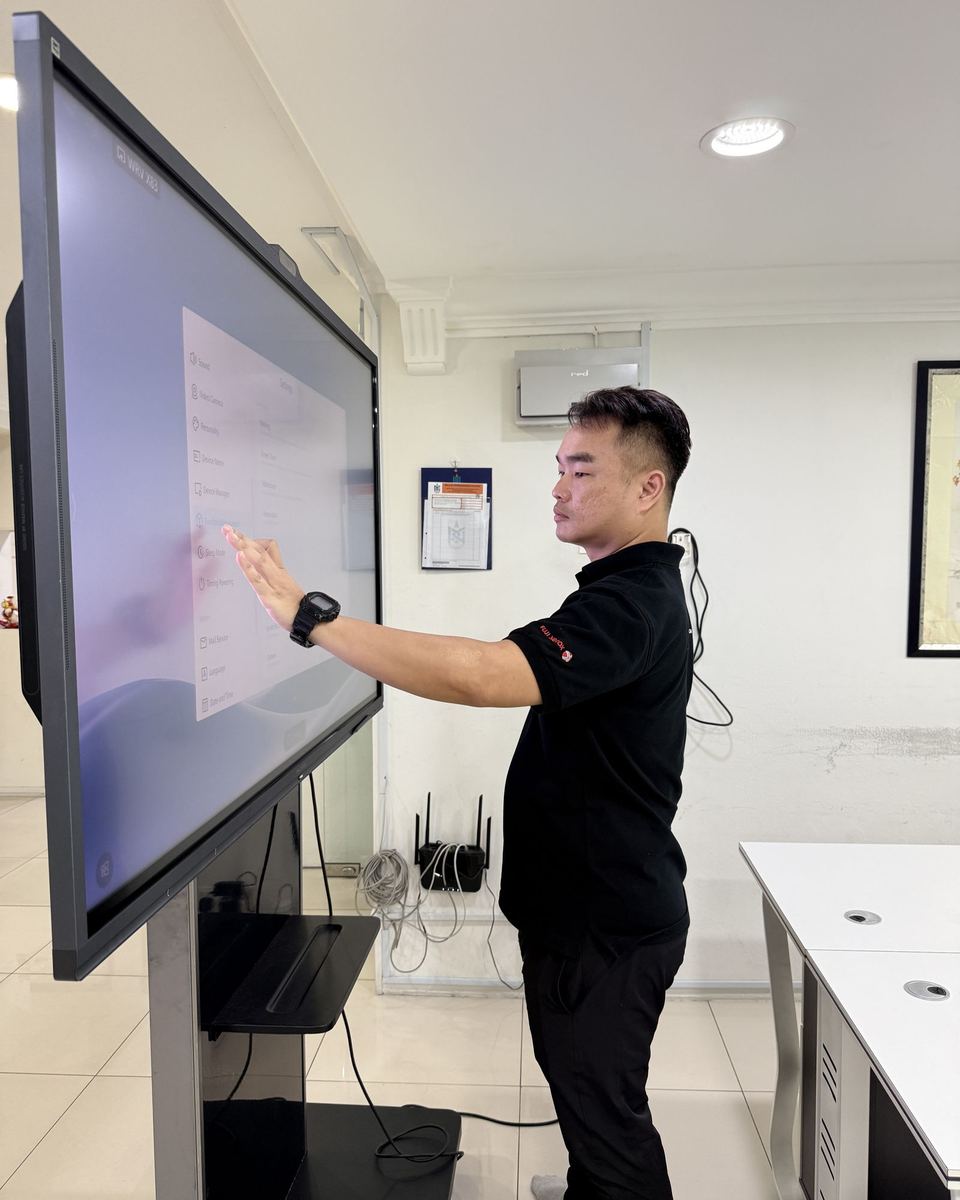 Hytech technician setting up an interactive panel