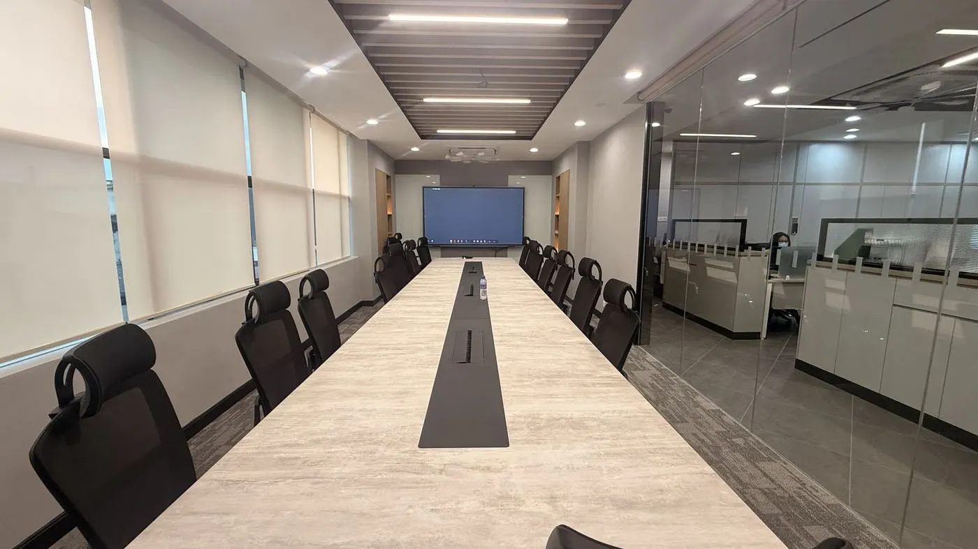 Glass-partition meeting room with an interactive panel
