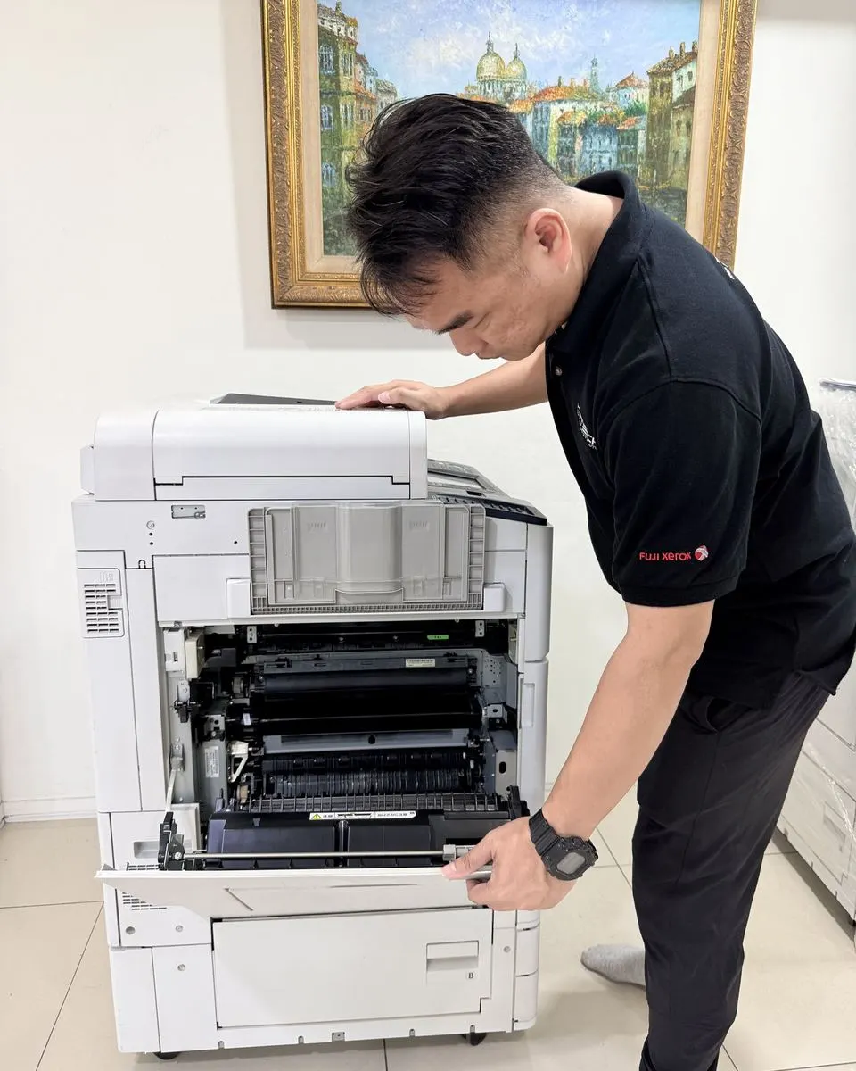 Hytech technician checking a photocopier