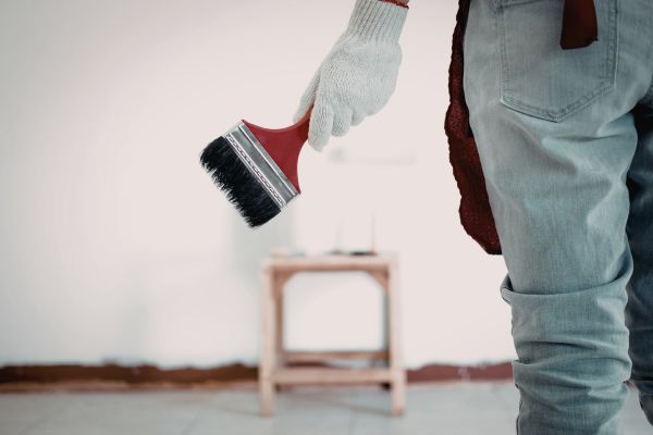 man holding a paint brush