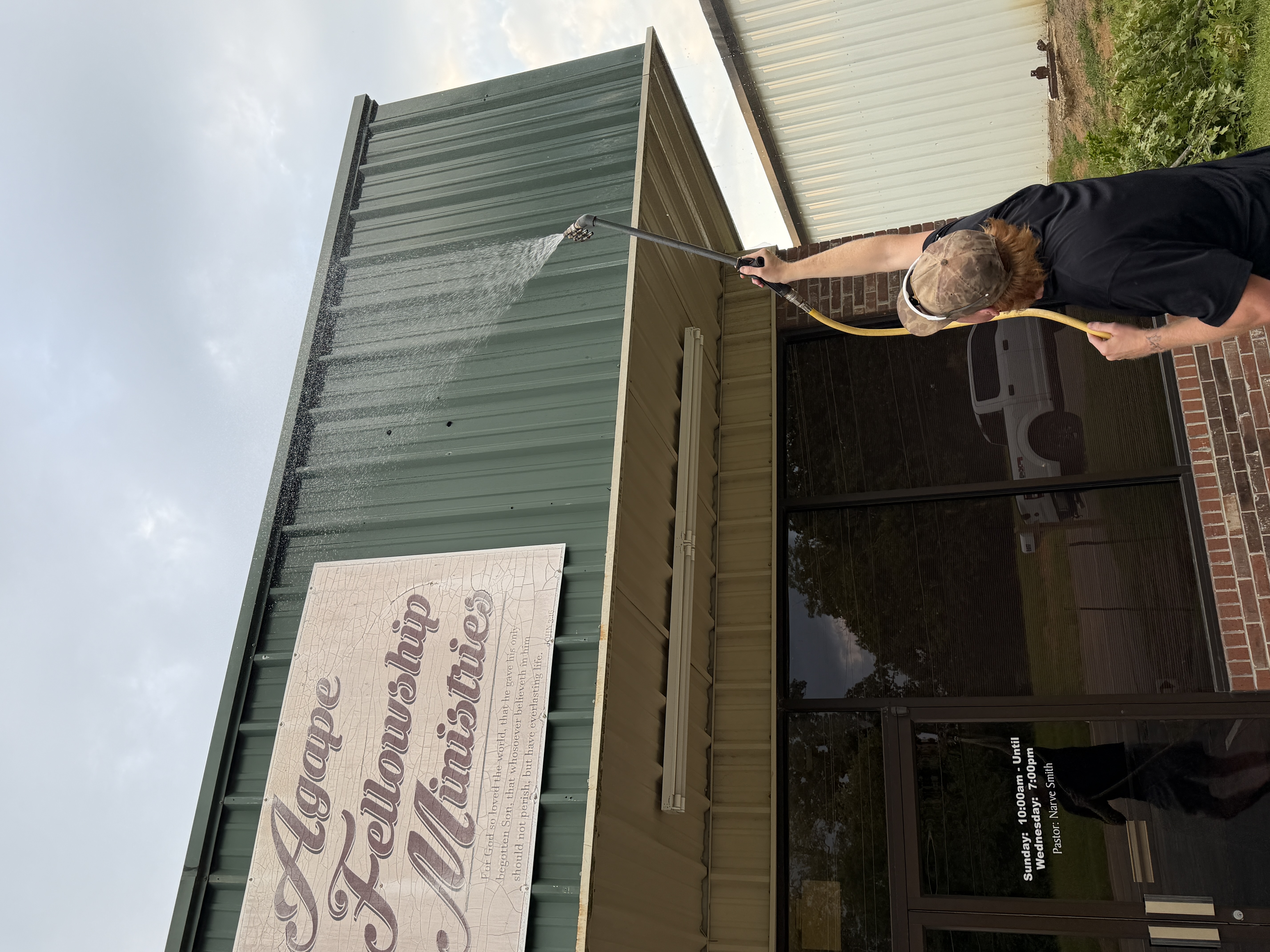 Metal roof cleaning restoring a faded metal roof in North Mississippi