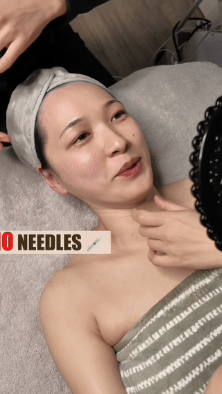 Therapist performing a contouring lifting massage along the jawline