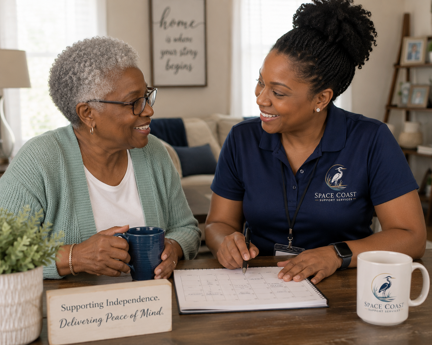 A Space Coast Support Services professional sharing a warm conversation with an older adult in a comfortable home