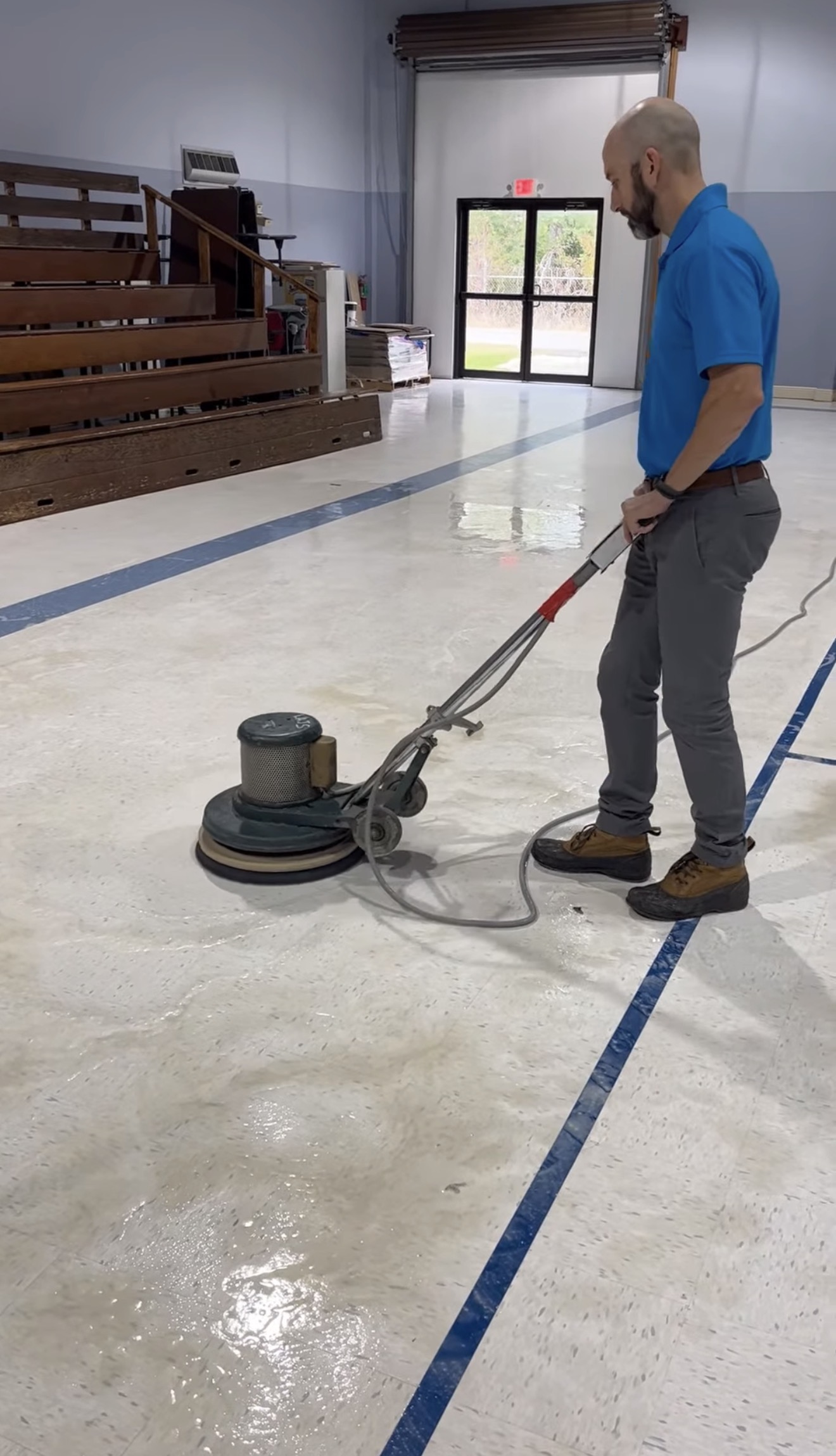Executive Touch owner stripping and waxing a commercial floor in Southwest Louisiana