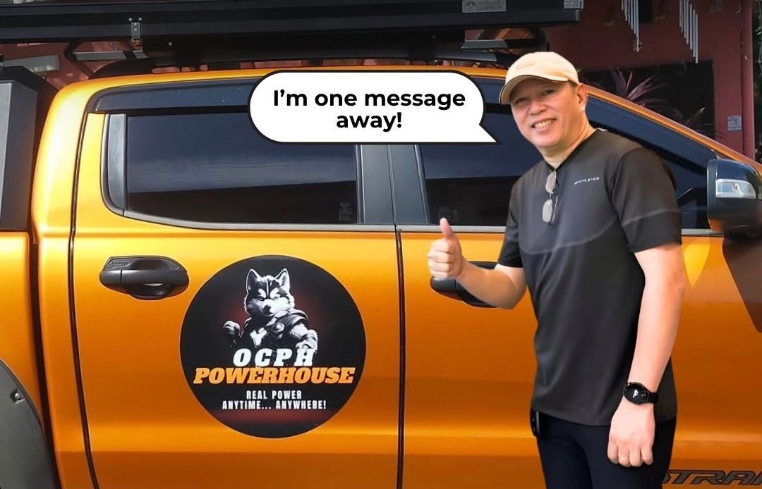 Choco Ocampo, owner and builder, standing beside the OCPH Powerhouse truck with a speech bubble reading “I’m one message away!”