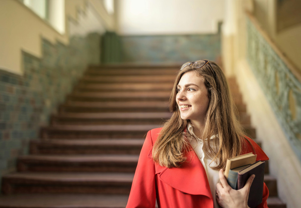 Female student with books preparing for med and law school admissions