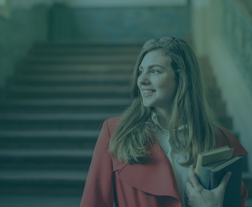 Female student with books preparing for med school admissions