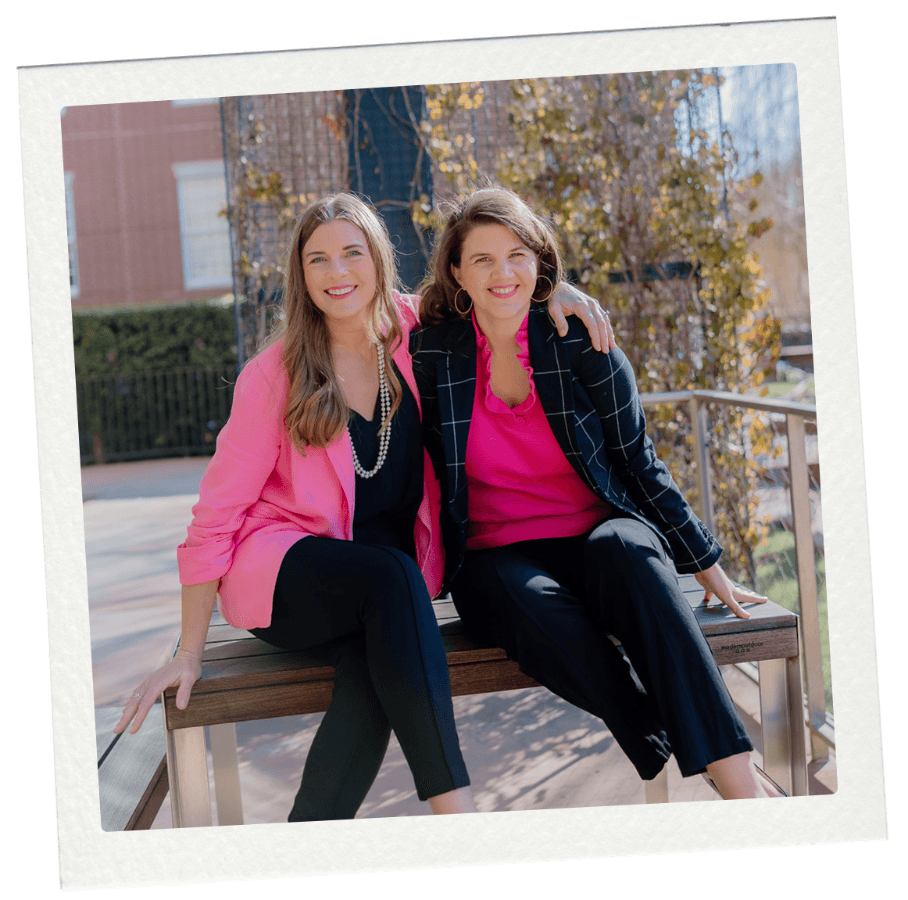 Autumn and Lizanne, admissions coaches, sitting on a campus bench