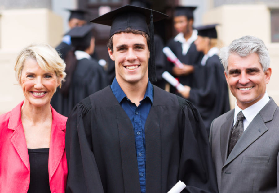 Admissions coaching student with parents during graduation