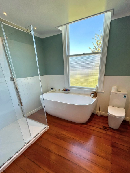 Bathroom renovation featuring freestanding bathtub and modern tapware